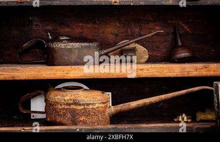 Collectable old oily usable oil cans on display at Astle Country Fair Chelford Cheshire Stock Photo