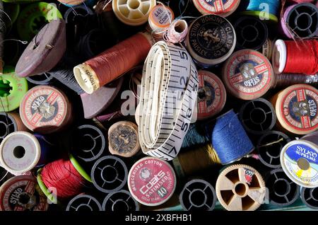 tape measure and cotton reels in sewing box Stock Photo
