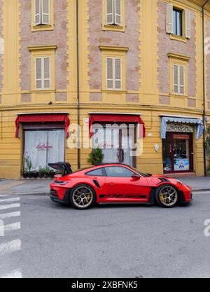 Italy, Rimini, june 12, 2024 - Modern red PORSCHE 911 GT3 RS in city streets Stock Photo