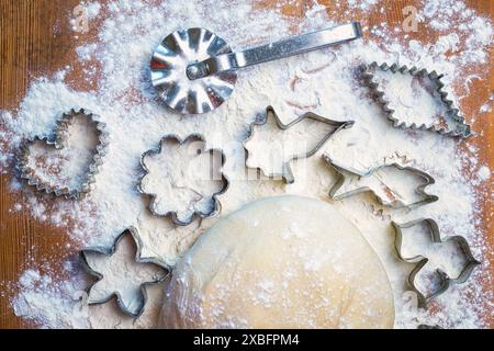 forms for squeezing the dough. dough on the table with dough tools. Stock Photo