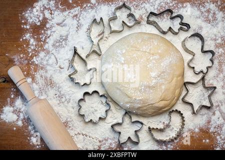 forms for squeezing the dough. dough on the table with dough tools. Stock Photo