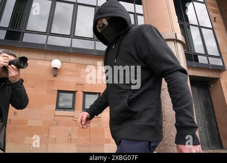 Adam Carruthers, 31, from Wigton, leaves Newcastle Crown Court, where he denied causing criminal damage following the felling of the Sycamore Gap tree, valued at £622,000 and £1,114 damage to Hadrian's Wall, which is a World Heritage Site. Picture date: Wednesday June 12, 2024. Stock Photo