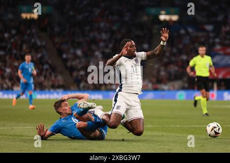 Ivan Toney of England tackled in the penalty area by Daniel Leo Gretarsson of Iceland - England v Iceland, International Friendly, Wembley Stadium, London, UK - 7th June 2024 Editorial Use Only Stock Photo