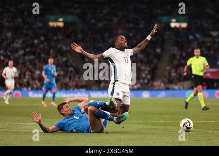 Ivan Toney of England tackled in the penalty area by Daniel Leo Gretarsson of Iceland - England v Iceland, International Friendly, Wembley Stadium, London, UK - 7th June 2024 Editorial Use Only Stock Photo