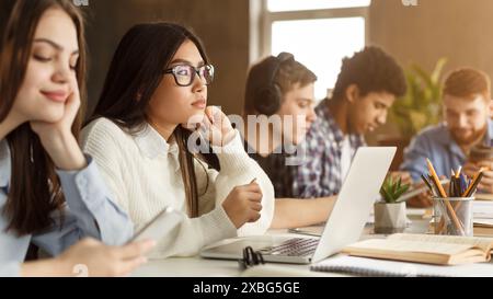 Group of Multiethnic Young Adults Engaged in Study Session Stock Photo