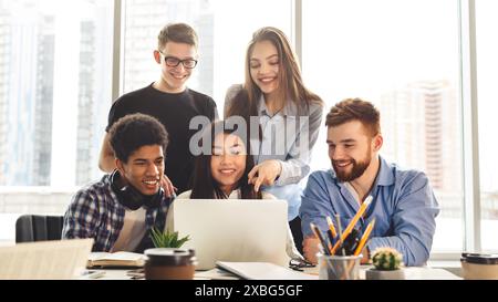 Group learning session with devices in library Stock Photo