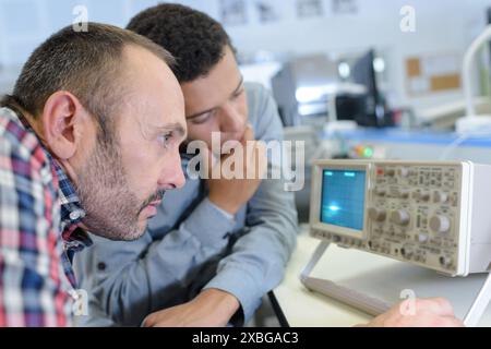 maintenance engineer programing in industry Stock Photo