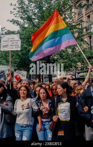 Paris, France, Group Young People, LGBTQI+ Activists, Organization, Marching with Gay Flag,  Anti-Extreme Right ,Slogan , N.G.O Stock Photo