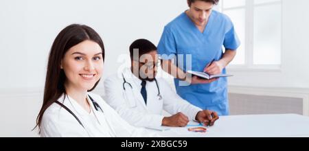 Team of doctors having meeting in medical office Stock Photo