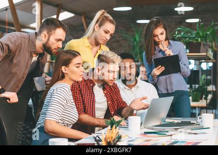 Startup concept. Young colleagues working on new project Stock Photo