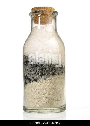 Stone and Sea Salt in a Bottle on white Background Stock Photo