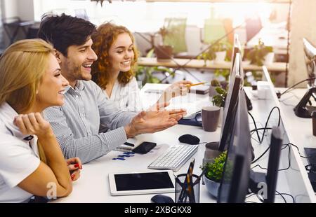 Innovative Young Professionals Engaged in Project Discussion Stock Photo