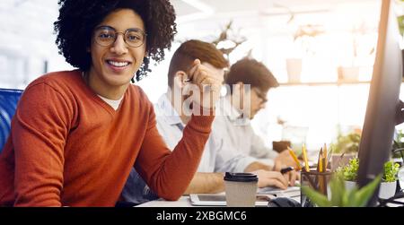 Smiling Young Man Wearing Glasses in Office During Working Hours Stock Photo