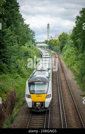 LONDON- JUNE 10, 2024: Morden South Railway Station and The Baitul Futuh Mosque in Morden, Merton, south west London Stock Photo