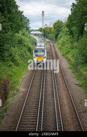 LONDON- JUNE 10, 2024: Morden South Railway Station and The Baitul Futuh Mosque in Morden, Merton, south west London Stock Photo