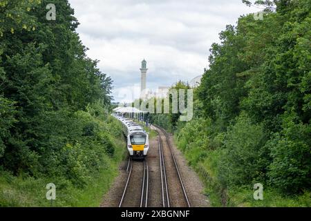 LONDON- JUNE 10, 2024: Morden South Railway Station and The Baitul Futuh Mosque in Morden, Merton, south west London Stock Photo