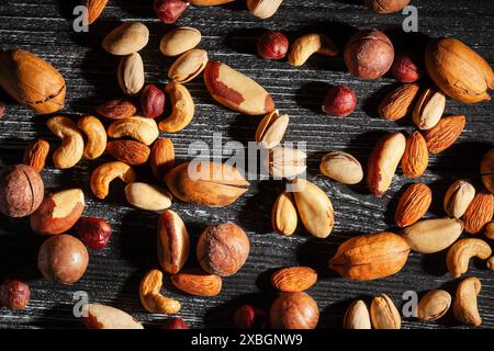 nuts mix on black wood background top view Stock Photo