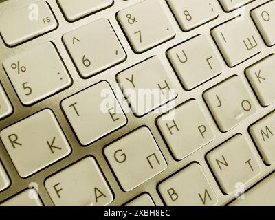 white keyboard against a window Stock Photo