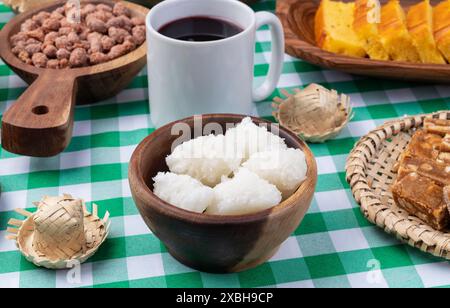 Typical brazilian june festival food over plaid fabric. Festa junina. Stock Photo