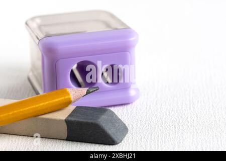 Pencil sharpener, eraser and a simple pencil on a white background. Office supplies Stock Photo