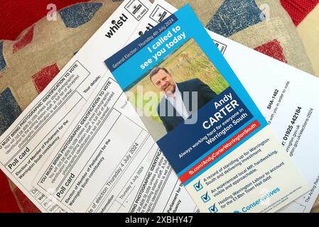 Conservative Tory general election campaign leaflet, on a union flag cushion, with polling cards, in Warrington South constituancy, Cheshire, England Stock Photo