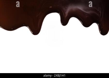 Melted chocolate dripping on white background Stock Photo