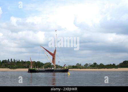 SB Pudge a woodenThames sailing barge 93 feet long and has a tonnage of 97 tons, anchored on the Blackwater River in Essex England Stock Photo