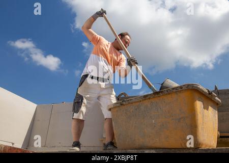 Bricklayer working on the construction site for a new detached house Stock Photo