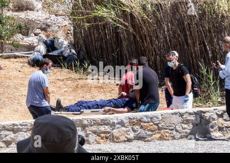 PHOTO:JEFF GILBERT Sunday 09th June.  Picture shows a Greek Fire Services officer carried away on a stretcher after falling closely to where the alleg Stock Photo