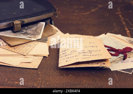 Postal letters in the vintage black handbag Stock Photo