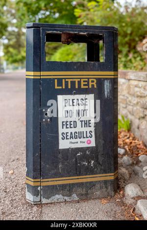 Please Do Not Feed The Seagulls sign on the side of a Litter bin. Stock Photo