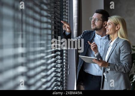 Business people enjoying work together using tablet for online project discussing Stock Photo