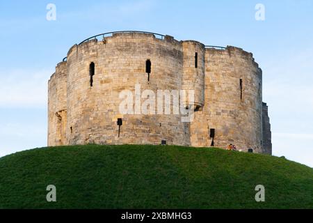 Historic landmark Clifford's Tower, a 13th century castle keep built on a grassed mound, formerly used as a prison and a royal mint. York, England Stock Photo