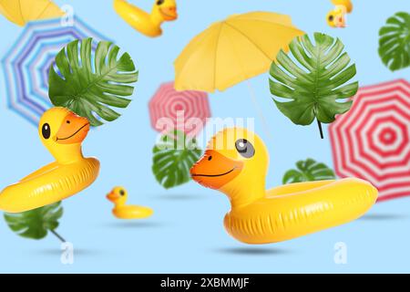 Summer party. Inflatable rings, beach umbrellas and tropical leaves in air on light blue background Stock Photo
