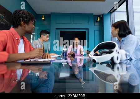 Business team gather in a modern, diverse conference room to collaborate on a startup Stock Photo