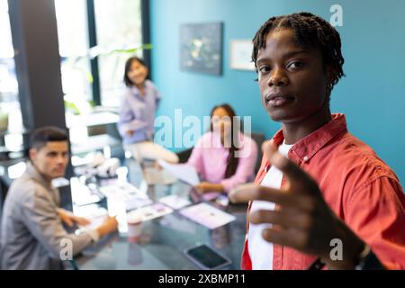 Diverse colleagues collaborating in modern office on startup business project Stock Photo