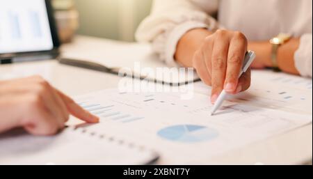 Business people, hands and pointing with documents for finance, profit or company revenue on office desk. Closeup of employee analysts with paperwork Stock Photo