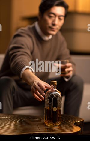 Mature Man Having Whiskey Stock Photo