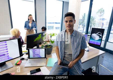 Colleagues in business collaborating on a startup in a modern office, copy space Stock Photo