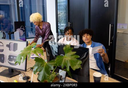 Diverse group of colleagues collaborating in modern office startup business Stock Photo