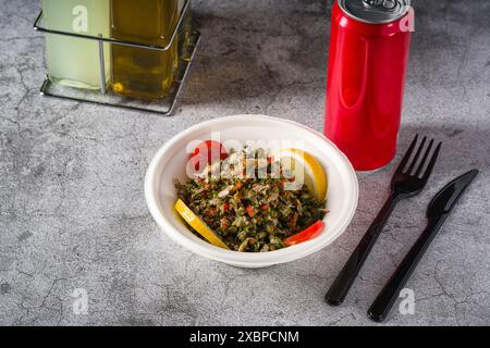 Healthy salad with capers, quinoa and walnuts on stone table Stock Photo