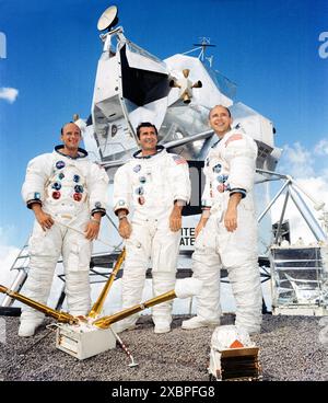 Apollo 12 prime crew members (left to right) Charles “Pete” Conrad Jr., commander; Richard Gordon Jr., command module pilot; and Alan Bean, lunar module pilot. Photographed in front of a full-scale mock-up of a lunar module in July 1969 before there successful lunar landing mission in November 1969. Stock Photo