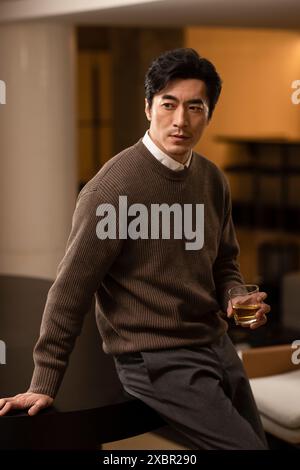 Mature Man Having Whiskey In A Club Stock Photo