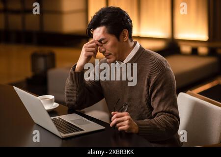 Stressed Out Businessman Having A Headache Stock Photo