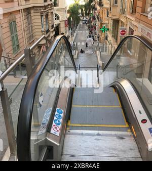 Escalator on city streets in Monaco with different levels. Elevator outside.  Stock Photo