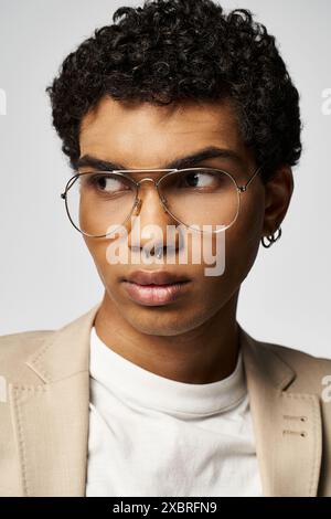 Handsome African American man with curly hair wearing trendy glasses. Stock Photo