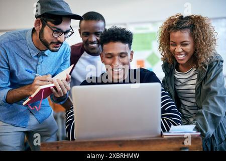 People, e learning and laptop for university as students in college or school in class for assignment. Teamwork, group and collaboration with notes on Stock Photo