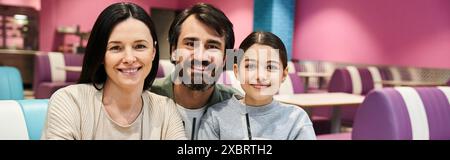 A happy family spending quality time together in a modern restaurant during the weekend. Stock Photo