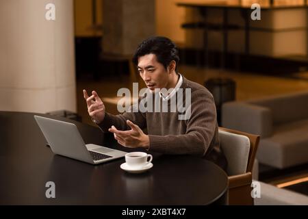 Male Teacher Remote Teaching Students Stock Photo