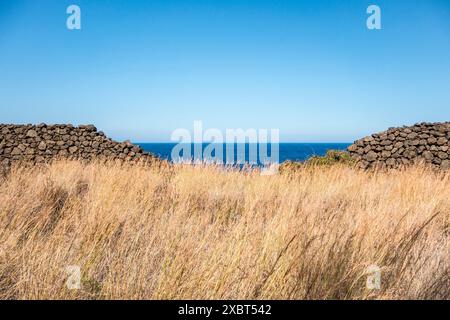 A view over the blue Mediterranean sea from the coast of Sicily, Italy, on a hot summer afternoon Stock Photo